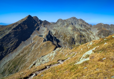 Mountain landscape in a sunny summer day with blue sky aboveの写真素材