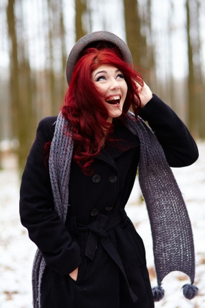 Outdoor closeup pose of laughing young girl in a forestの写真素材