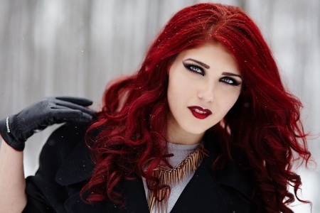 Closeup portrait of a gothic redheaded woman