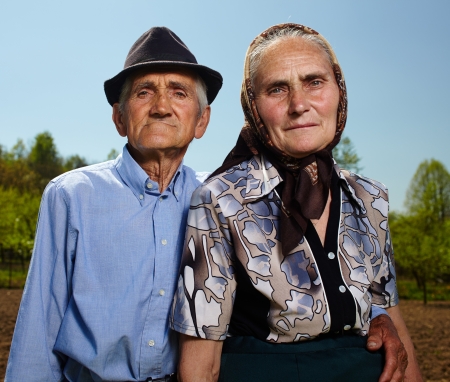 Closeup of an old farmers couple outdoorの写真素材