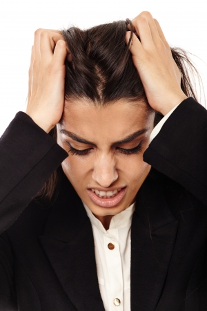 Middle Eastern business woman with strong migraine isolated on whiteの写真素材