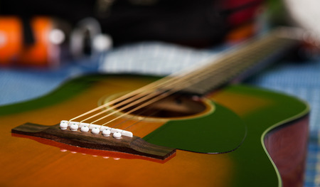Closeup of a classical acoustic guitar with selective focus