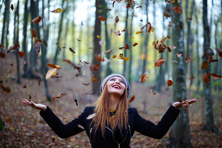 Fashionable blonde girl, outdoor portrait in the forestの写真素材