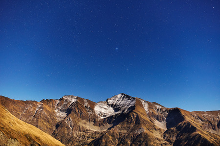 Mountains and clear night sky full of starsの写真素材