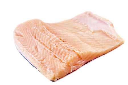 Uncooked trout filletes isolated on white backgroundの写真素材