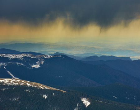 Landscape with curtains of torrential heavy rain in the mountainsの写真素材