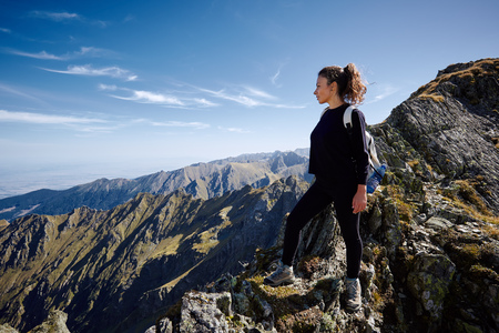 Young caucasian woman hiker on a rocky mountain trailの写真素材