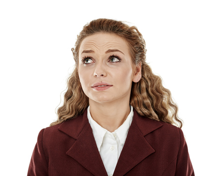 Closeup of a stressed young businesswoman isolated on white