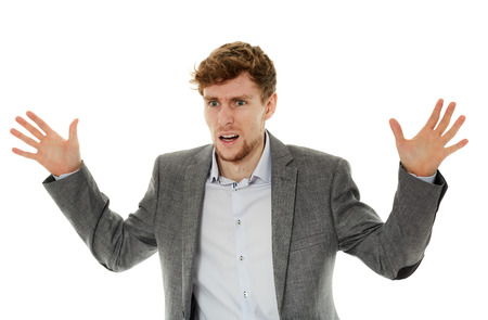 Angry stressed young businesswoman over white backgroundの写真素材