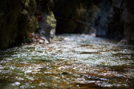 Landscape with a river flowing through a mountain canyonの写真素材
