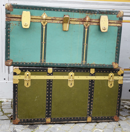 Old luggage with retro aspect near a wallの写真素材