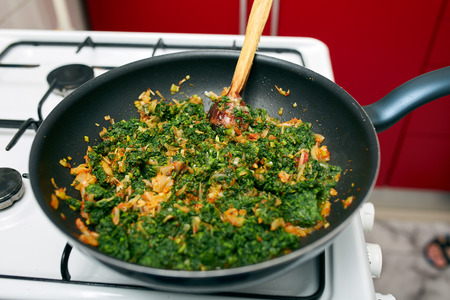 Preparing a delicious nettle porridge as side dish or vegetarian mealの写真素材