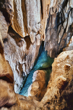 Emerald crystal clear lake inside of a caveの写真素材