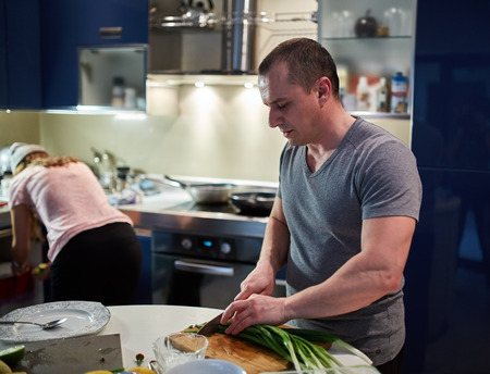 Couple cooking at home in a modern kitchenの写真素材