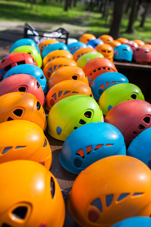 Helmets for rock climbers, arranged in rows outdoor