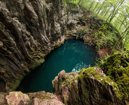 Lacul Dracului in Romania, a lake formed after cave ceiling collapsedの写真素材