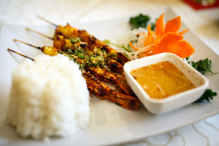 Vietnamese recipe of shrimp skewers with rice and sauceの写真素材