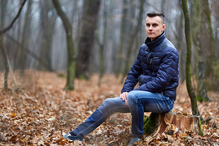 Trendy and handsome teenage boy in the parkの写真素材