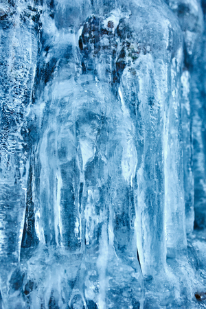 Beautifully shaped icicles on a mountain from a frozen waterfall