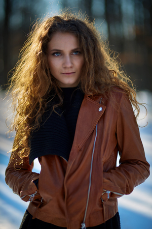 Beautiful caucasian woman in a winter day, closeup shotの写真素材