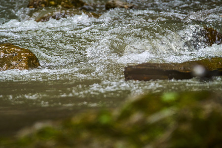 Mountain river and rapids in a spring day