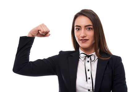 Strength of hispanic young businesswoman on white backgroundの写真素材