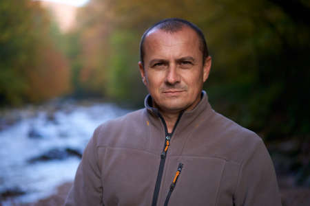 Closeup portrait of a middle aged man with intense look outdoor