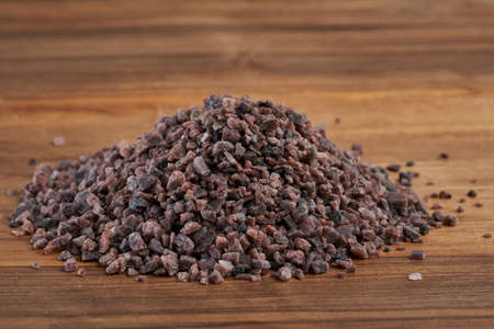 Closeup of Hymalaian black salt on a wooden boardの写真素材