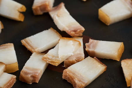 Diced pork smoked ham in the frying panの写真素材