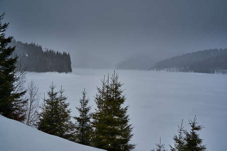 Frozen lake in the mountains during winter timeの写真素材