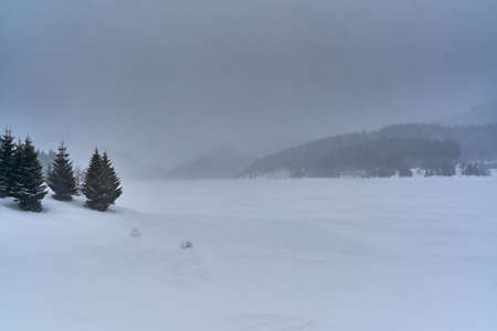 Frozen lake in the mountains during winter timeの写真素材