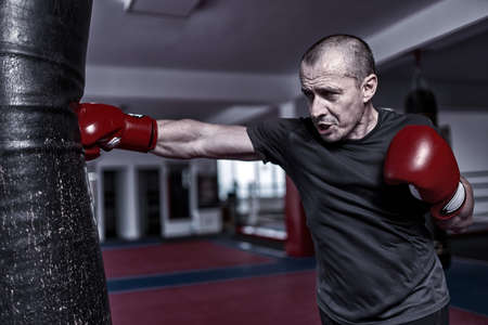 Boxer training with the heavy bag