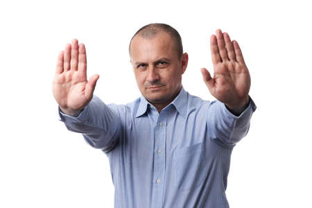 Businessman in blue shirt making stop sign, isolated on white background