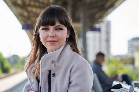 Candid portrait of a young woman in urban environment