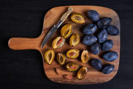 Cooking blue plums jam from freshly picked juicy fruitsの写真素材