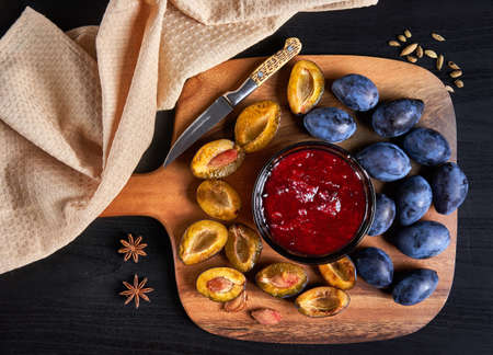 Cooking blue plums jam from freshly picked juicy fruitsの写真素材