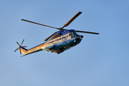 Stop motion of a helicopter in flight against clear blue skyのeditorial素材