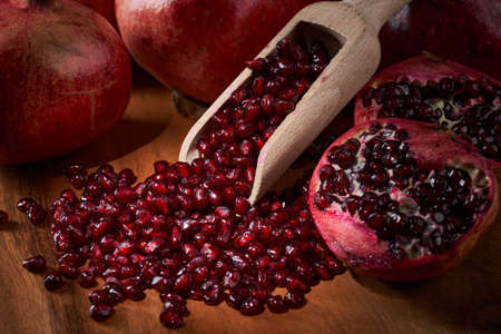 Delicious fresh pomegranate fruits and seeds, studio shot with professional lightingの写真素材