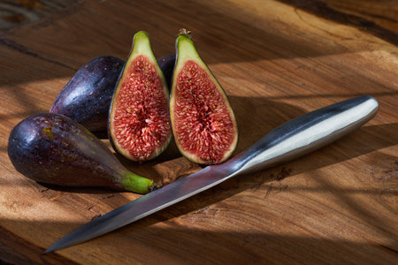 Organic fresh figs on a wooden board, studio closeupの写真素材
