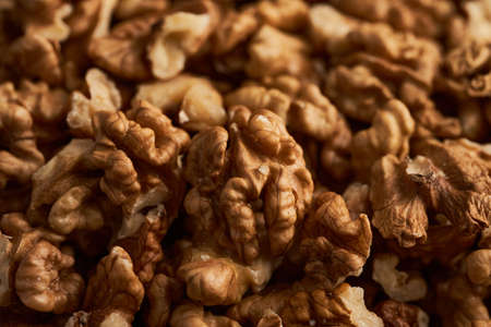 Studio shot of walnuts on a vintage wooden board
