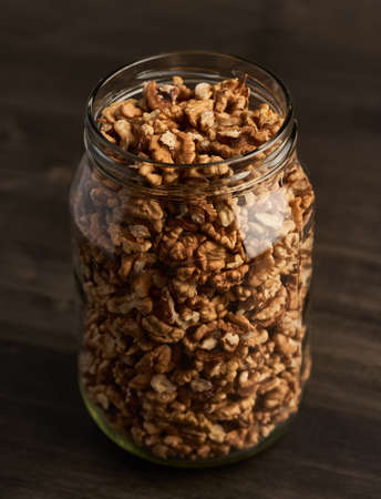 Studio shot of walnuts on a vintage wooden boardの写真素材