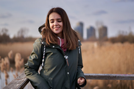 Closeup of a young woman outdoor in late winter, early springの写真素材