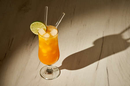 Orange non alcoholic cocktail with ice, a refreshing summer drinkの写真素材