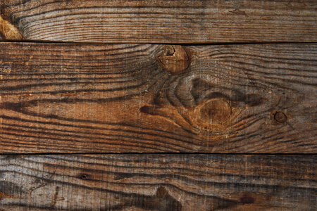 Wooden hand crafted board shot in flat lay with plenty of copyspace available, as backgroundの写真素材