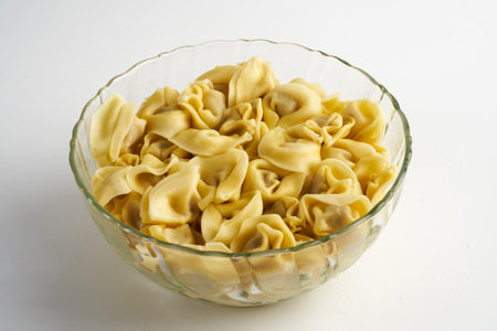 Italian tortellini (stuffed pasta) filled with prosciutto cotto, cookedの写真素材