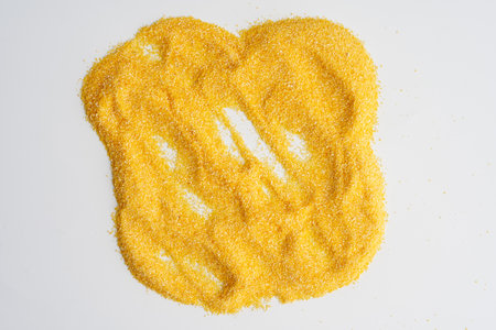 Closeup of ground maize in a coarse corn flour, highly detailedの写真素材