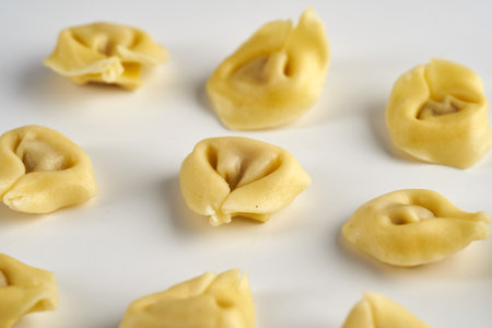 Tortellini stuffed Italian pasta isolated on white backgroundの写真素材