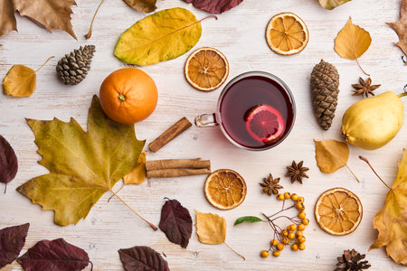 Mulled wine or GlÃ¼hwein on a rustic wooden board with natural decorの写真素材
