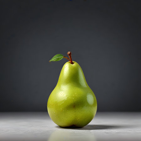 Green pear on a gray background. Copy space for your text.の素材