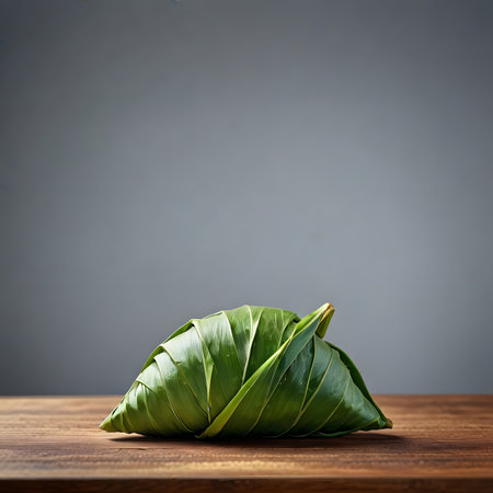 Steamed rice dumpling on wooden table over gray background.の素材
